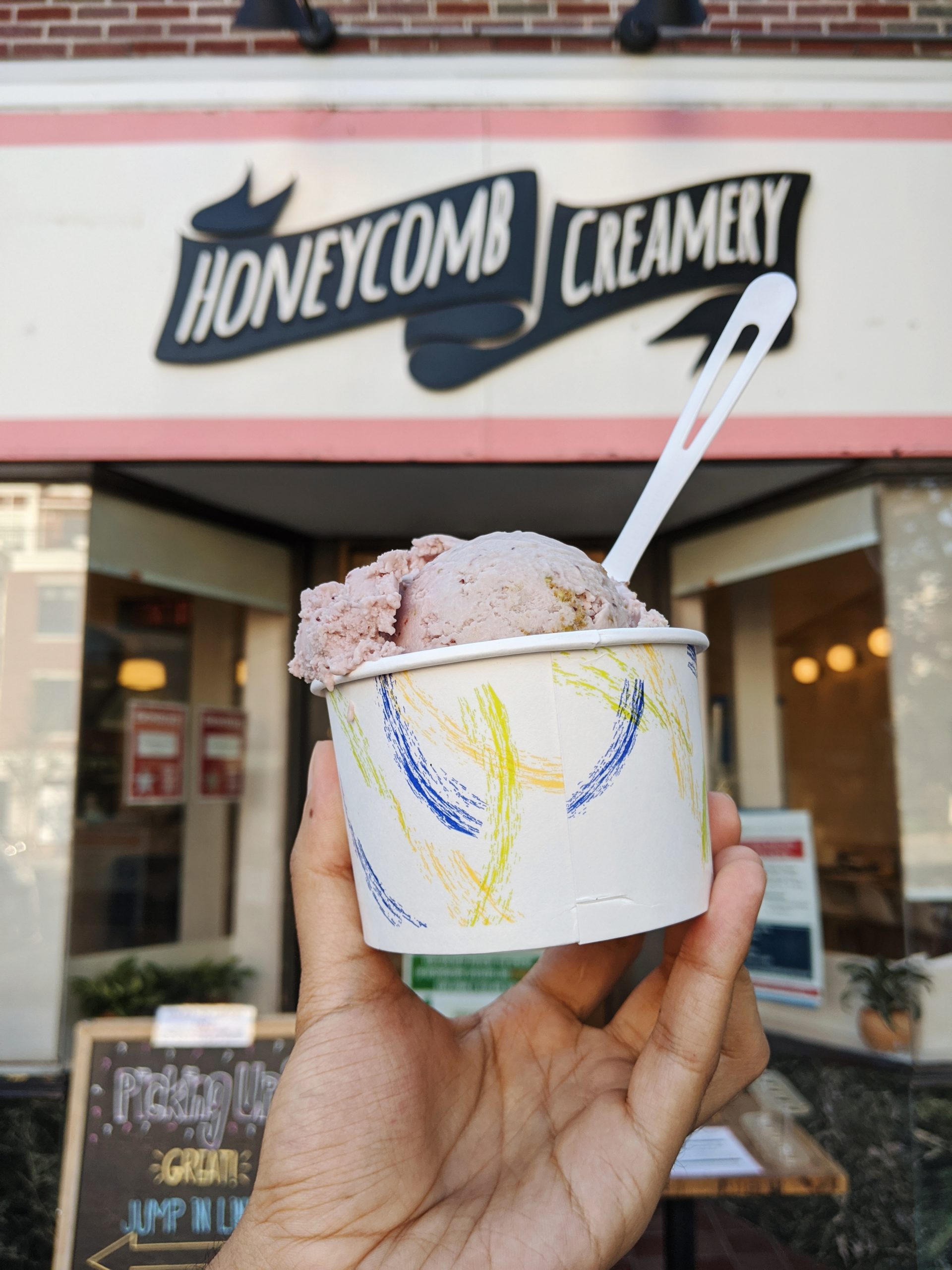 Honeycomb Creamery storefront with vegan ice cream in foreground