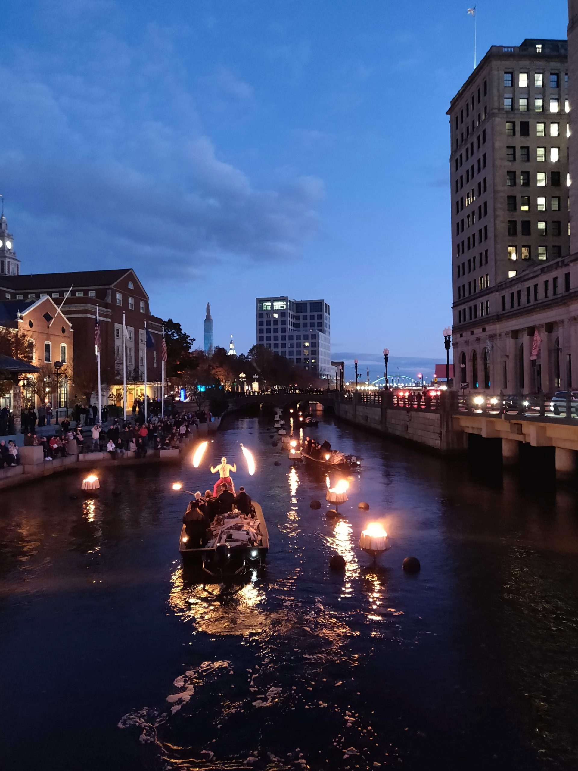 Waterfire in Providence, RI with a fire performer on a boat