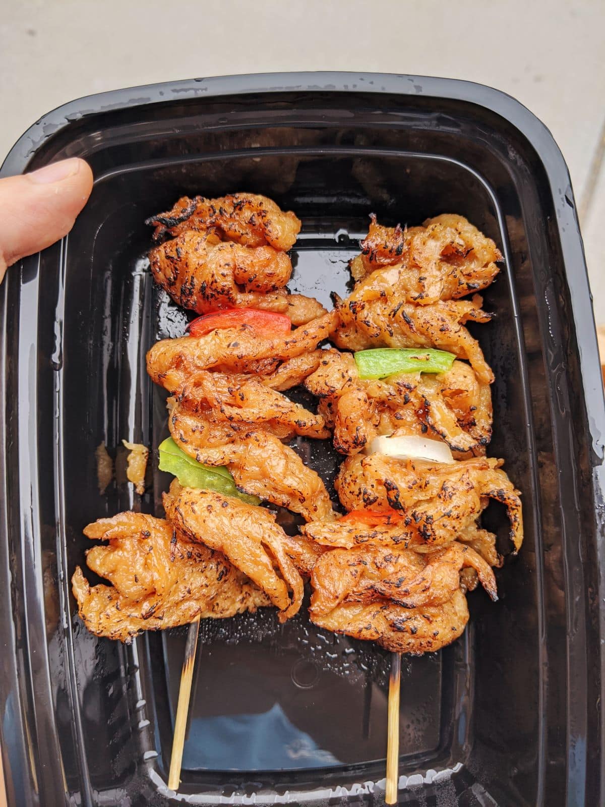 soy skewers in a takeout box