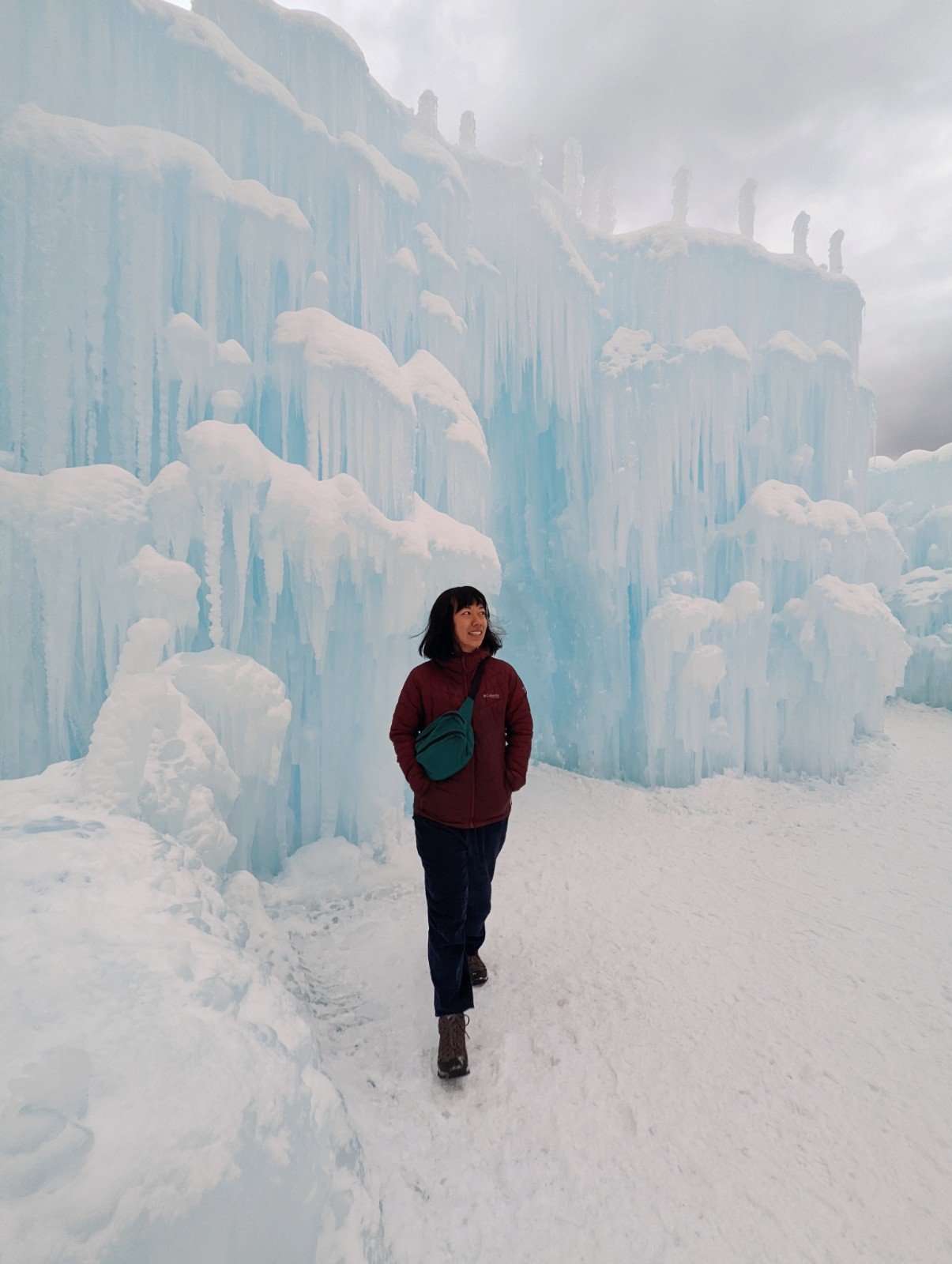 Me posing in front of an Ice Castle archway during the day